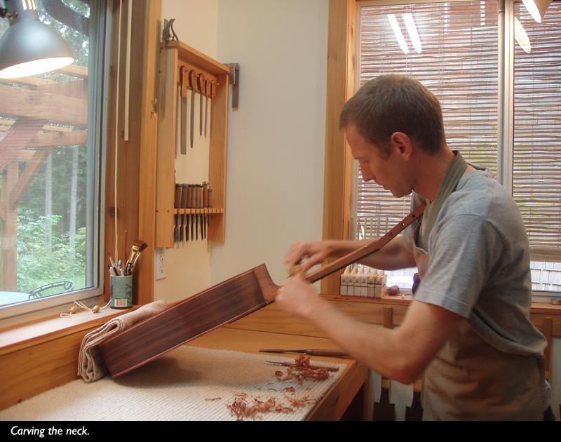 carving the neck of a double-top guitar